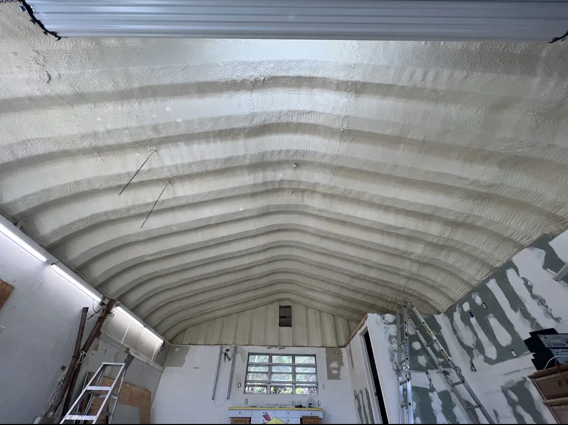 Spray polyurethane foam applied to the underside of a metal roof deck in Jonesboro